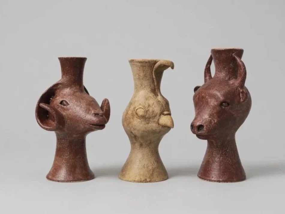 Three ceramic vessels — ram, gambrel quail, and bison — in Peruvian-inspired forms.